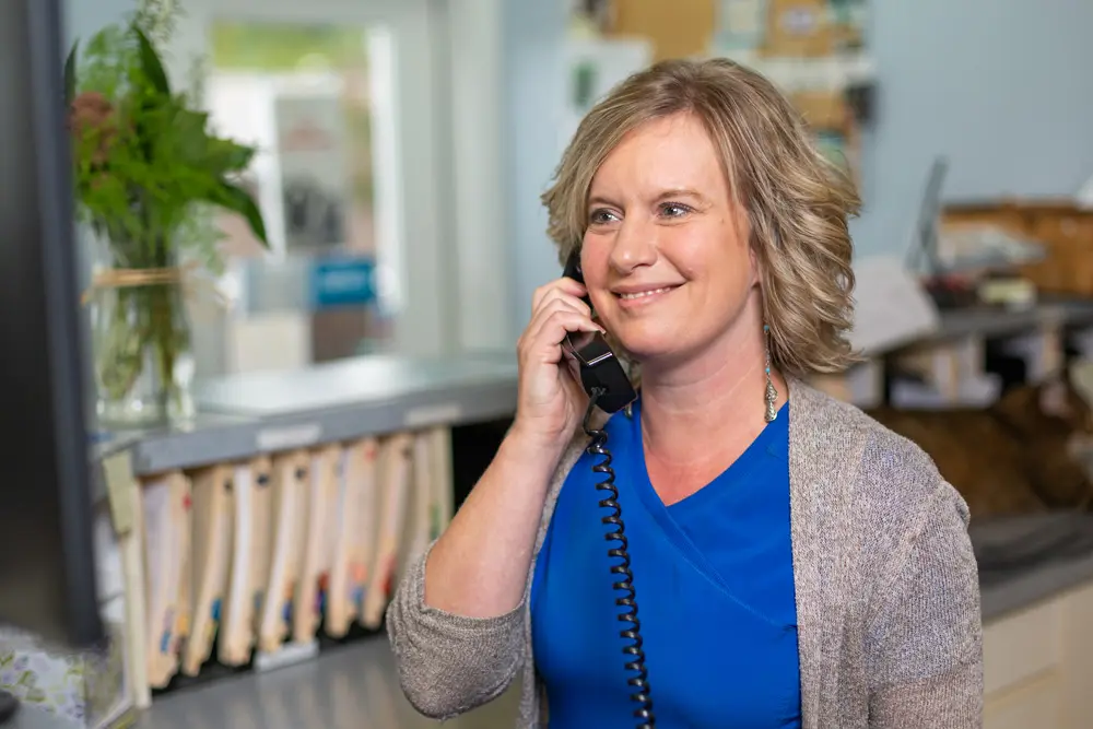 By Pass Animal Clinic receptionist answering the phone